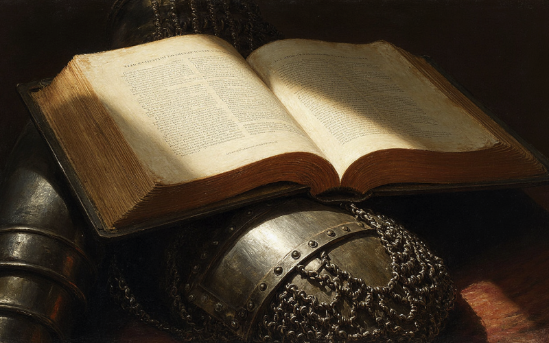 Pessoa determinada orando com Bíblia aberta em Efésios 6, demonstrando preparação espiritual e fé em ambiente de estudo bíblico sereno